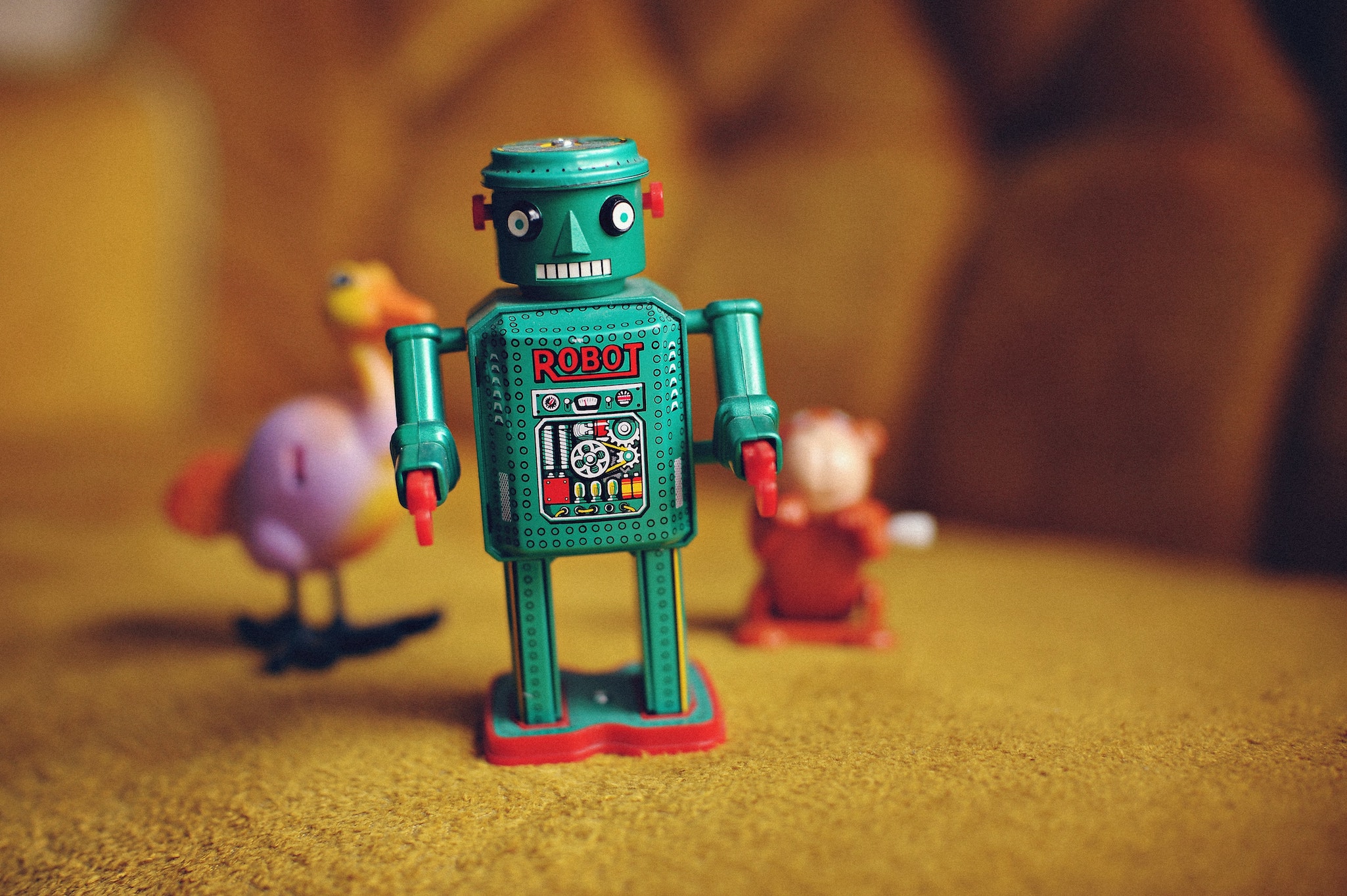 Small wind-up toy robot on a table